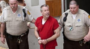 Drew Peterson being led away by police